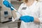 Woman lab technician take blood sample from test tube