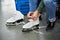 Woman laces figure skates in sports shop