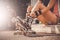 Woman laces up her skates sitting on curb