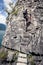 Woman on ladder on mountain ferrata