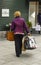 A woman laden with carrier bags while enjoying some retail therapy at the up market Kildare Village shopping outlet in County Kil