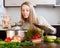 Woman with ladle cooking soup