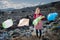 Woman on landfill, consumerism versus plastic pollution concept.