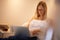 Woman, laptop and journalist in relax on chair typing, reading or writing in living room at home. Calm female person