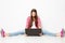 Woman and Laptop, Stretched Legs Apart, Surprised Astonished Girl with Notebook Sitting on Floor over White