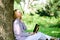 Woman with laptop work outdoors lean tree. Minute for relax. Education technology and internet concept. Girl work with