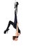 Woman in latex catsuit on aerial hoop