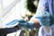 Woman in latex gloves cleaning railing with wet wipe and detergent, closeup