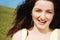 Woman laughing in field