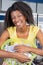 Woman With Laundry Basket At Laundromat