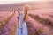 Woman lavender field sunset. Romantic woman walks through the la