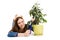 Woman laying on the floor cutting plant