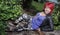 Woman laying on a tree bark