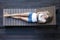 Woman laying on wooden sunbed