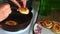 A woman lays out ready-made pancakes from a frying pan on a plate. Preparation of pancakes..mov