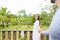 Woman Lead Man Holding Hand On Summer Terrace With Beautiful Green Wood Landscape Happy Smiling Young Couple