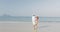 Woman Leading Man Couple Running On Beach Holding Hands Young Happy Tourists On Vacation