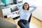 Woman leaning back in chair at work