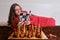 Woman learning chess from book  self study board game at home