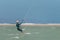 Woman learning kitesurfing, girl at kiteboarding school. Kite surf lessons in the Canary islands, Fuerteventura.  Girl doing the