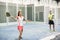 Woman learning in paddle tennis class