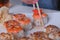 Woman learning to eat with chopsticks rolls. Hand close-up.