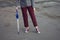 woman legs with her umbrella and rain coat, ready for the weather