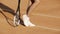 woman legs, pretty athlete woman in sportswear posing on tennis court