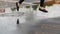Woman legs run and jump in puddle, water splash