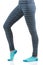 Woman legs in thermal pants and blue socks from the side view standing on one leg with other bent at the knee leg