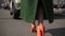 woman legs walking on cobblestone street