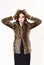 Woman in leopard fur coat isolated on white. Leopard fur at stylish girl. Fur coat boutique with natural and artificial