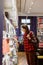 woman in a library or bookstore chooses a book to read. a European female student or a teaching researcher