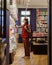 woman in a library or bookstore chooses a book to read. a European female student or a teaching researcher