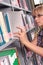 Woman at library shelf