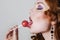 Woman licking candy