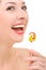 Woman licking candy on white background