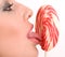 Woman licking lollipop