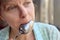 Woman licking spoon