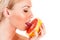 Woman licks grapefruit pulp