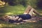 woman lies on a blanket and relax in nature