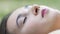 Woman lies on grass looks indifferently, female problems, health depression slow