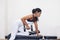 Woman Lift Up Dumbbell For Tricep and Biceo Workout  in a Gym