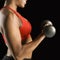 Woman lifting dumbbell.