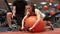 Woman lifting dumbbells with her trainer