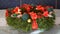 Woman light up candles of a advent wreath