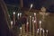 Woman lighting prayer candle