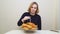 a woman lights candles and makes a wish on a hamburger cake. original cake.