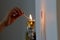 A woman lights Shabbat candles