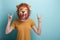 Woman in lion mask with hands in rock sign, isolated